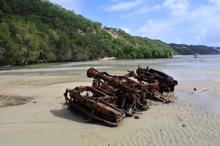 Stranded car wreckage on sandy beach in Cape York peninsula Queensland, Australia.の写真素材