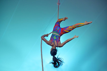 GOLD COAST - FEB 17 2024:Female rope acrobat on acrobatics performance.In China, acrobatics have been a part of the culture since the Tang dynasty (203 BC).のeditorial素材