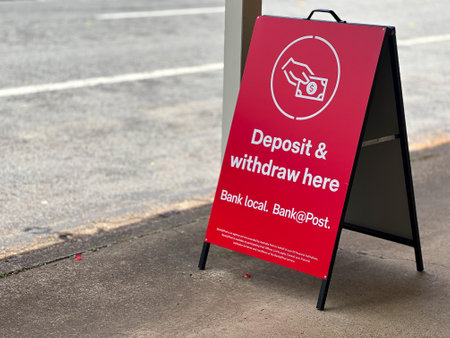 BRISBANE - NOV 08 2023:Australia Post deposit and withdraw cash sign. Australia Post connect Australian consumers, businesses and government bodies such as bill payment, banking and identity services.のeditorial素材