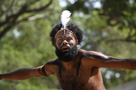 LAURA,QLD - JULY 08 2023:Indigenous Australians man on ceremonial dance in Laura Quinkan Dance Festival Cape York Australia. Ceremonies combine dance, song, rituals, body decorations and costumesのeditorial素材