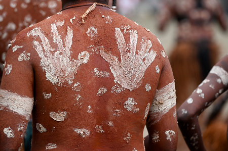 LAURA,QLD - JULY 08 2023:Indigenous Australians men on ceremonial dance in Laura Quinkan Dance Festival Cape York Australia. Ceremonies combine dance, song, rituals, body decorations and costumesのeditorial素材