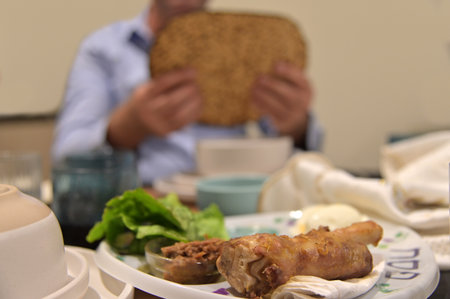 Jewish man hold handmade shmura matzo unleavened flatbread used at the Passover Seder especially for...