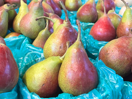 Buckets full of Pears displayed for sale in local marketの写真素材