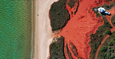 Panoramic Aerial drone landscape view of four wheel drive vehicle 4WD car and an off road caravan camping in Cape Leveque near Broome in Dampier peninsula in the Kimberely region Western Australia.の写真素材