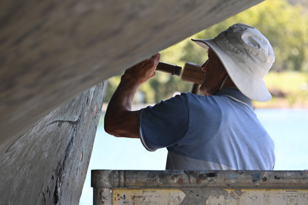 PORT MACQUARIE -  DEC 02 2025:Boat repair worker services include
general repairs, engine maintenance, and specialized tasks like gelcoat and paint refinishing.のeditorial素材