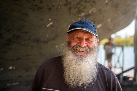 PORT MACQUARIE -  DEC 03 2025:Portrait of a boat repair worker during services include
general repairs, engine maintenance, and specialized tasks like gelcoat and paint refinishing.のeditorial素材