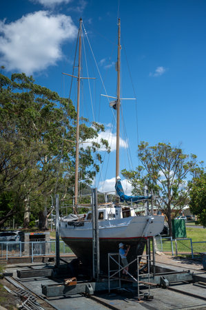 PORT MACQUARIE -  DEC 03 2025:Boat repair worker services includegeneral repairs, engine...