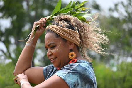 COFFS HARBOUR, NSW - JAN 26 2026:Indigenous Australians female dancing, a profound expression of culture, connecting women to Ancestors, Country, and community through movement, song, and storytelling. Performances, often featuring traditional, sacred, orのeditorial素材