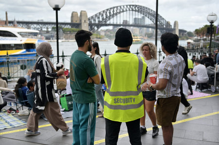 SYDNEY - DEC 31 2025:Security officer patrol on new years eve celebration. A security...