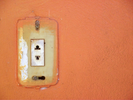 old stained jack on orange wall backgroundの写真素材