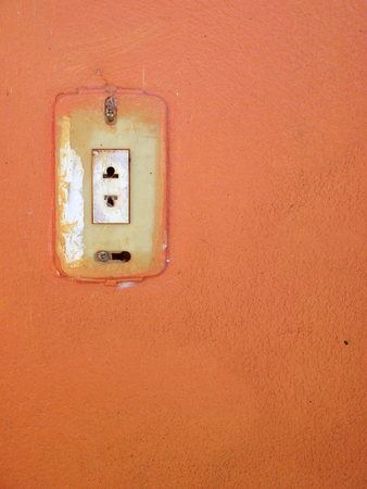 old stained jack on orange wall backgroundの写真素材