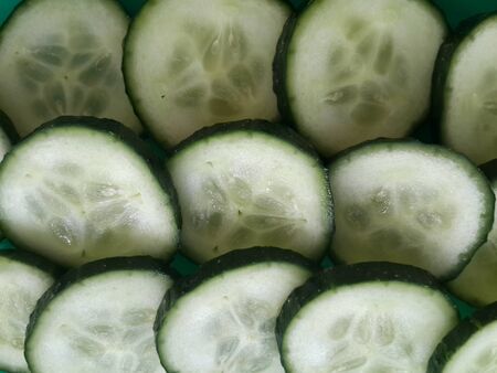 cucumber slices on a green platterの写真素材