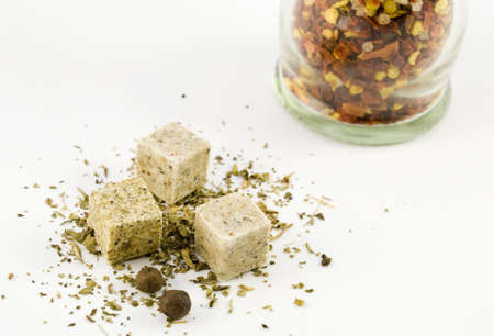 Pepper and stock cube herbs and spices arranged on a white backgroundの写真素材