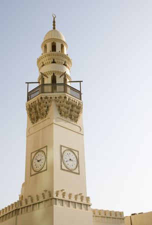 Mosque tower against clear sky in Manama, Kingdom of Bahrainの写真素材