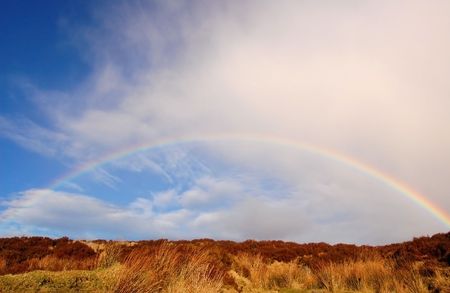 Rainbow over the heather hill in Wicklow Mountains, Irelandの写真素材