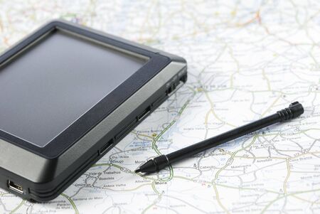GPS global positioning device arranged with stylus pen and mapの写真素材