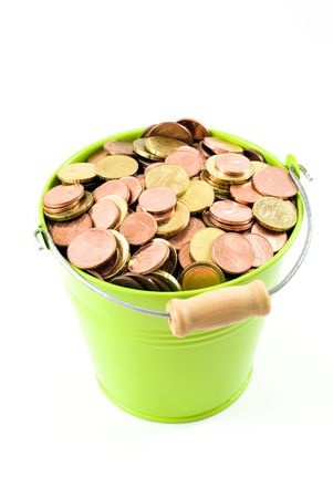 Euro coins in a green bucket isolated on white backgroundの写真素材