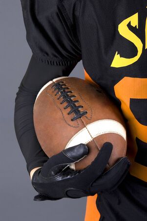 American football player holding ballの写真素材