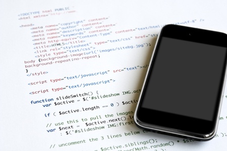 HTML script and modern smartphone with blank screen for copy space