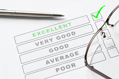 Survey form close up with tick on excellentの写真素材