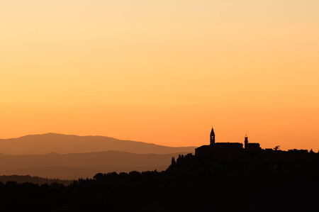 Church on top of hills silhouette - Tuscany, Italyの写真素材