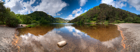 Panoramic view over Upper Lake in Glendalough Scenic Park Co. Wicklow Irelandの写真素材