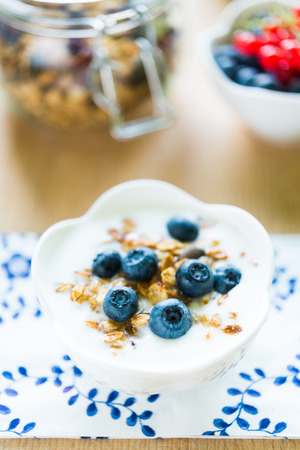 Healthy breakfast with granola, blueberries and redcurrantの写真素材
