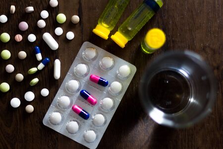 In this photo illustration pharmaceutical pills are seen displayed on a table. Dexamethasone, Hydroxychloroquine are used to treat coronavirus (COVID-19) diseaseの写真素材