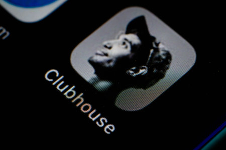 February 10, 2021, Brazil. In this photo illustration the Clubhouse logo seen displayed on a smartphone screen. In background the flag of Chinaのeditorial素材