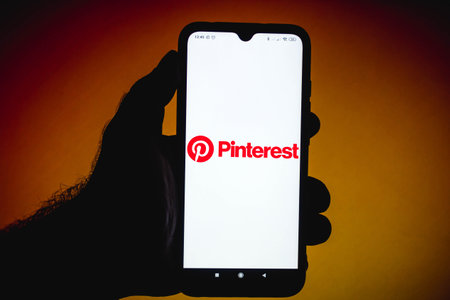 February 4, 2021, Brazil. In this photo illustration the Drizly logo seen displayed on a smartphone screen with the logos of Uber in the backgroundのeditorial素材