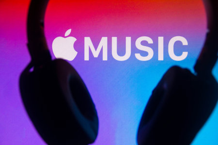 July 6, 2021, Brazil. In this photo illustration the Apple Music logo is displayed along with the headset. It is a music and video streaming service developed by Appleのeditorial素材
