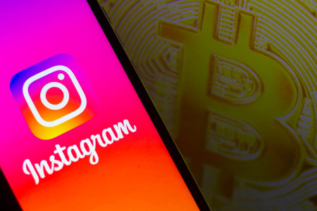 August 7, 2021, Brazil. In this photo illustration the  displayed on a smartphone. In the background, the bitcoin cryptocurrency is displayedのeditorial素材