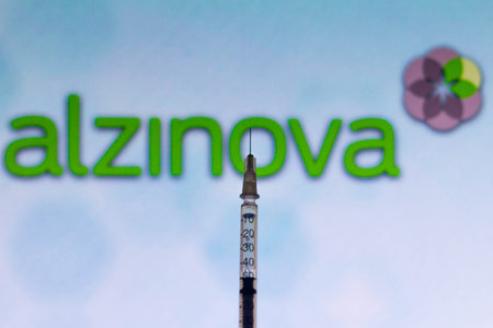 November 17, 2021, Brazil. In this photo illustration of the medical syringe seen with the Alzheimer's Vaccine inscription displayed on a screen in the backgroundのeditorial素材