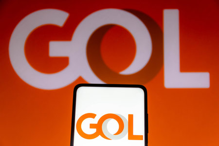 November 10, 2021, Brazil. In this photo illustration the Air China logo is displayed on a smartphone screen and in the backgroundのeditorial素材