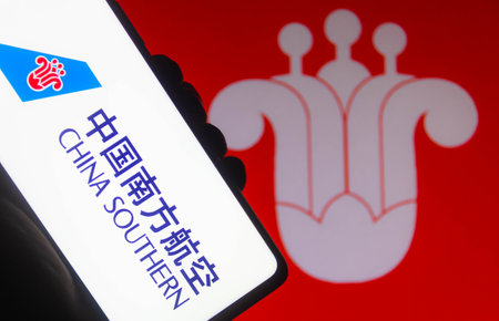 November 10, 2021, Brazil. In this photo illustration the Air China logo is displayed on a smartphone screen and in the backgroundのeditorial素材