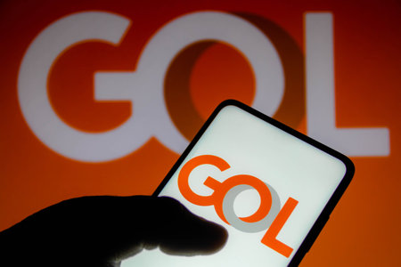 November 10, 2021, Brazil. In this photo illustration the Air China logo is displayed on a smartphone screen and in the backgroundのeditorial素材