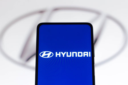 November 9, 2021, Brazil. In this photo illustration FIAT logo is seen on a smartphone screen and in the backgroundのeditorial素材