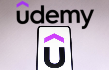 November 1, 2021, Brazil. In this photo illustration the Udemy logo displayed on a smartphone and on the backgroundのeditorial素材