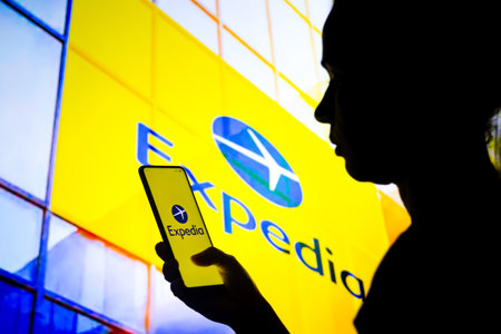 March, 30 2022, Brazil. In this photo illustration, a woman's silhouette holds a smartphone with the Samsung Electronics logo displayed on the screen and in the backgroundのeditorial素材