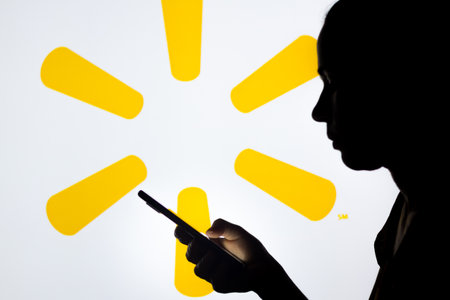 March, 30 2022, Brazil. In this photo illustration, a woman's silhouette holds a smartphone with the...