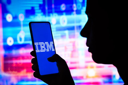 April 10, 2022, Brazil. In this photo illustration, a woman holds a smartphone with the Intel Corporation displayed on the screenのeditorial素材