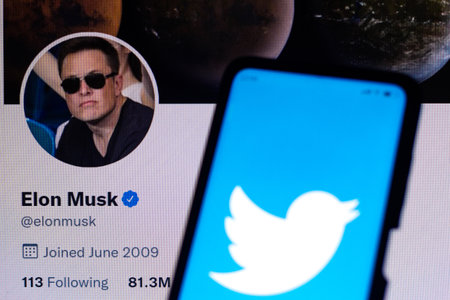 April 11, 2022, Brazil. In this photo illustration the Twitter logo seen displayed on a smartphone with the Elon Musk's official Twitter profileのeditorial素材