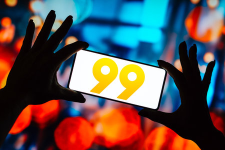 October 2, 2023, Brazil. In this photo illustration, the 99 logo is displayed on a smartphone screenのeditorial素材