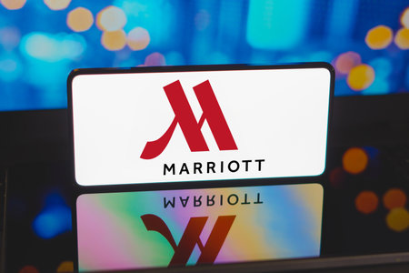 November 20, 2023, Brazil. In this photo illustration, the Marriott logo is displayed on a smartphone screenのeditorial素材