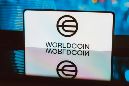 November 21, 2023, Brazil. In this photo illustration, the Worldcoin logo is displayed on a smartphone screenのeditorial素材