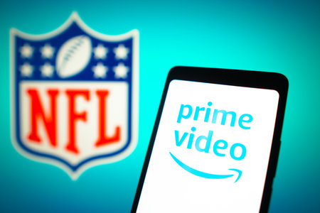 January 23, 2024, Brazil. In this photo illustration, the Amazon Prime Video logo is displayed on a smartphone screen and National Football League (NFL) logo in the backgroundのeditorial素材