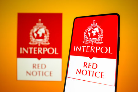 January 25, 2024, Brazil. In this photo illustration, the Interpol Red Notice logo is displayed on a...