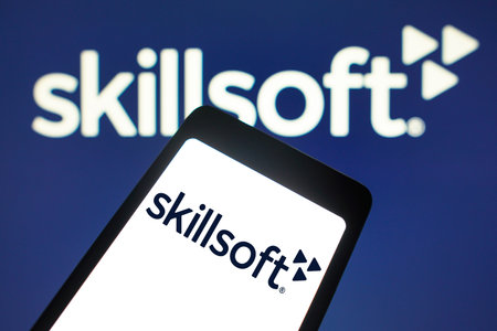 February 6, 2024, Brazil. In this photo illustration, the Skillsoft logo is displayed on a smartphone screen and in the backgroundのeditorial素材