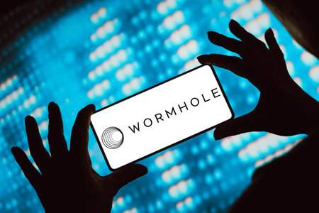 February 15, 2024, Brazil. In this photo illustration, the Wormhole logo is displayed on a smartphone screenのeditorial素材