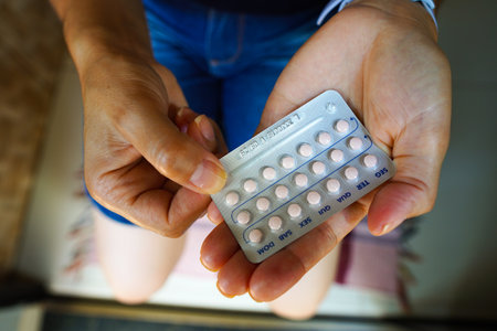March 16, 2024, Brazil. A woman holds her birth control pill. The first over-the-counter birth control pill will be available in US stores at the end of March, 2024の写真素材